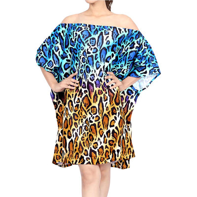 woman in off the shoulder short caftan with blue and golden leopard print
